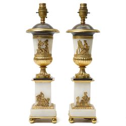 Pair of early 20th-century Neoclassical lamp bases in gilt bronze and alabaster, each deco...
