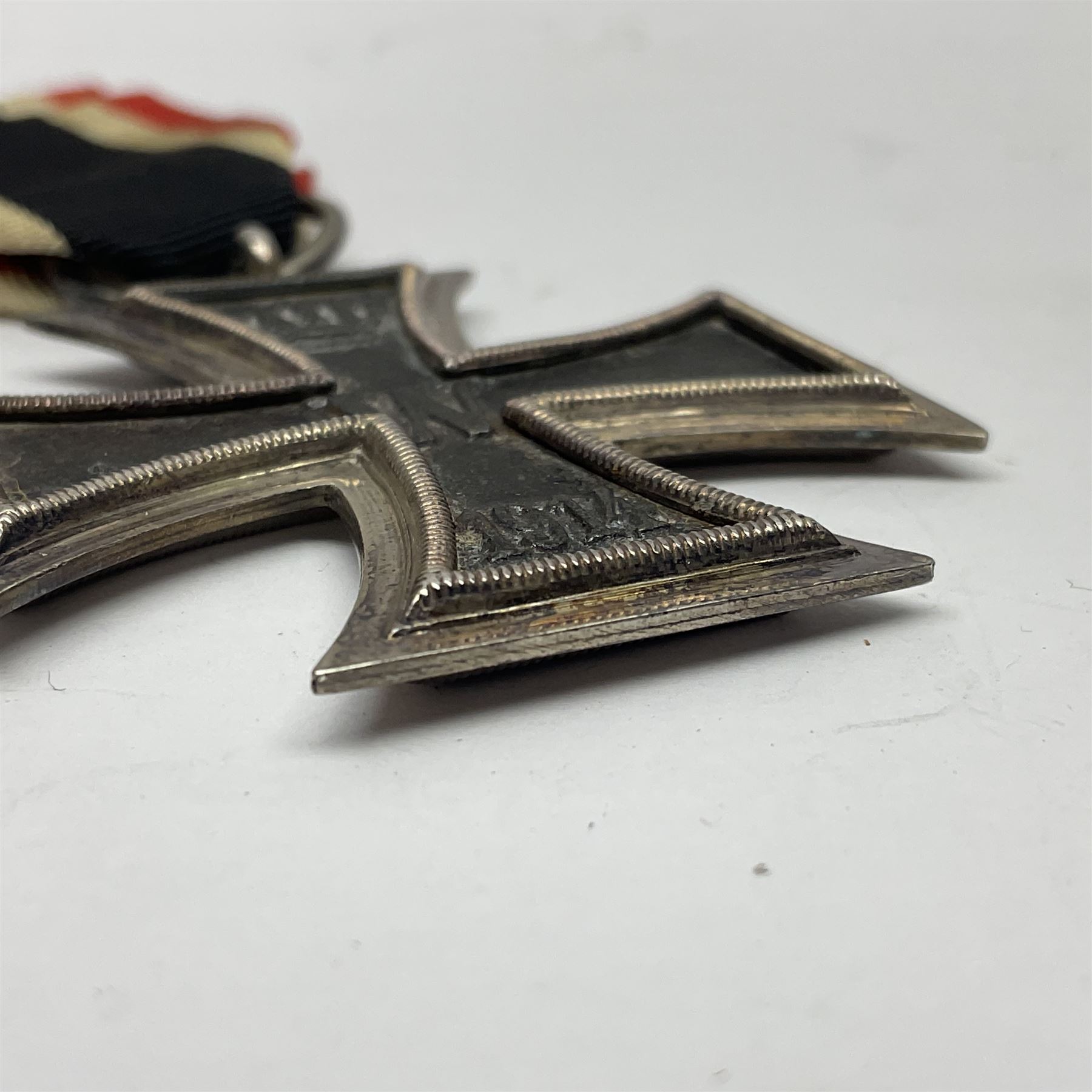 WWI Imperial German Iron Cross 2nd Class, the suspension ring indistinctly stamped M8?; with WWII ribbon