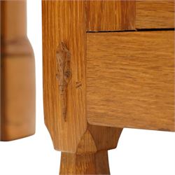 Lizardman - oak 5' sideboard, rectangular top over three panelled frieze drawers, fitted with two double panelled cupboards with wrought iron handles and locks, raised on tapered octagonal feet, with carved lizard signature, by Derek Slater of Crayke