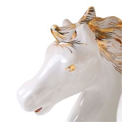 Italian-style ceramic table-lamp featuring two white running horses with gold accents, with cream tasselled lampshade, upon a wooden base, approx. H60cm W40cm