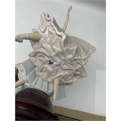 Lladro figure group, 'Merry Ballet', modelled as two ballerinas in dancing pose, raised on a turned socle base, no. 5035, printed marks beneath, H49cm