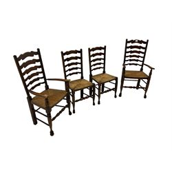 Set of four quality elm ladder back dining chairs, comprising two carver armchairs and two side chairs, with rush seats