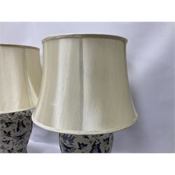 Pair of table lamps of baluster form, decorated in a butterfly motif with a cream group, upon a circular base, including shade H60cm