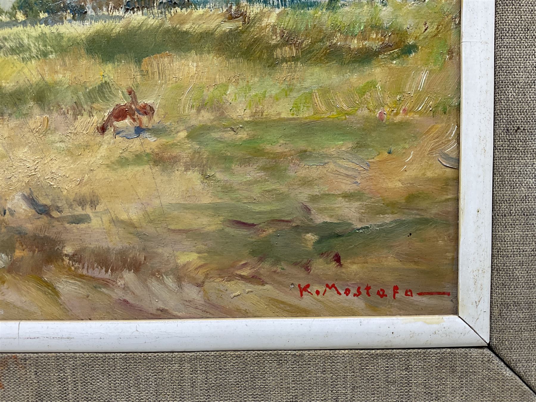 Kamel Moustafa (Egyptian 1917-1982): Goatherd and Flock, oil on panel signed 25cm x 47cm