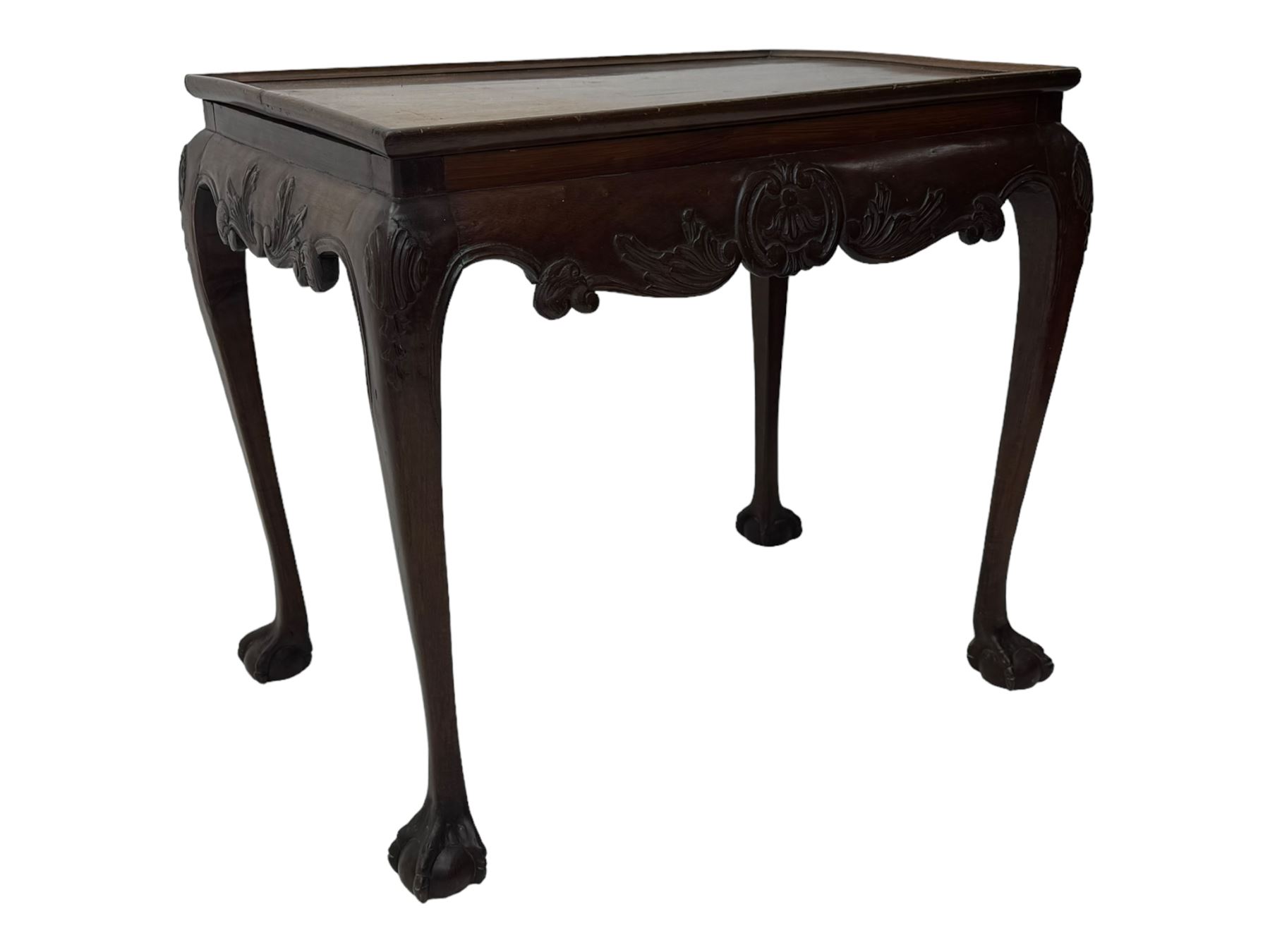 Late 19th to early 20th century mahogany side table, rectangular top with applied raised moulding, curved upper rails carved with C-scroll cartouches and extending curled leaves, bellflower carved cabriole supports with ball and claw feet 