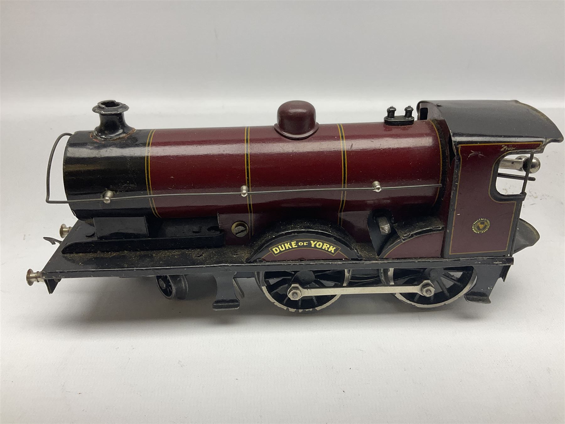 Bassett-Lowke '0' gauge - clockwork 4-4-0 locomotive 'Duke of York' No.1931 with tender, lithographed LMS crimson/black; original box with key