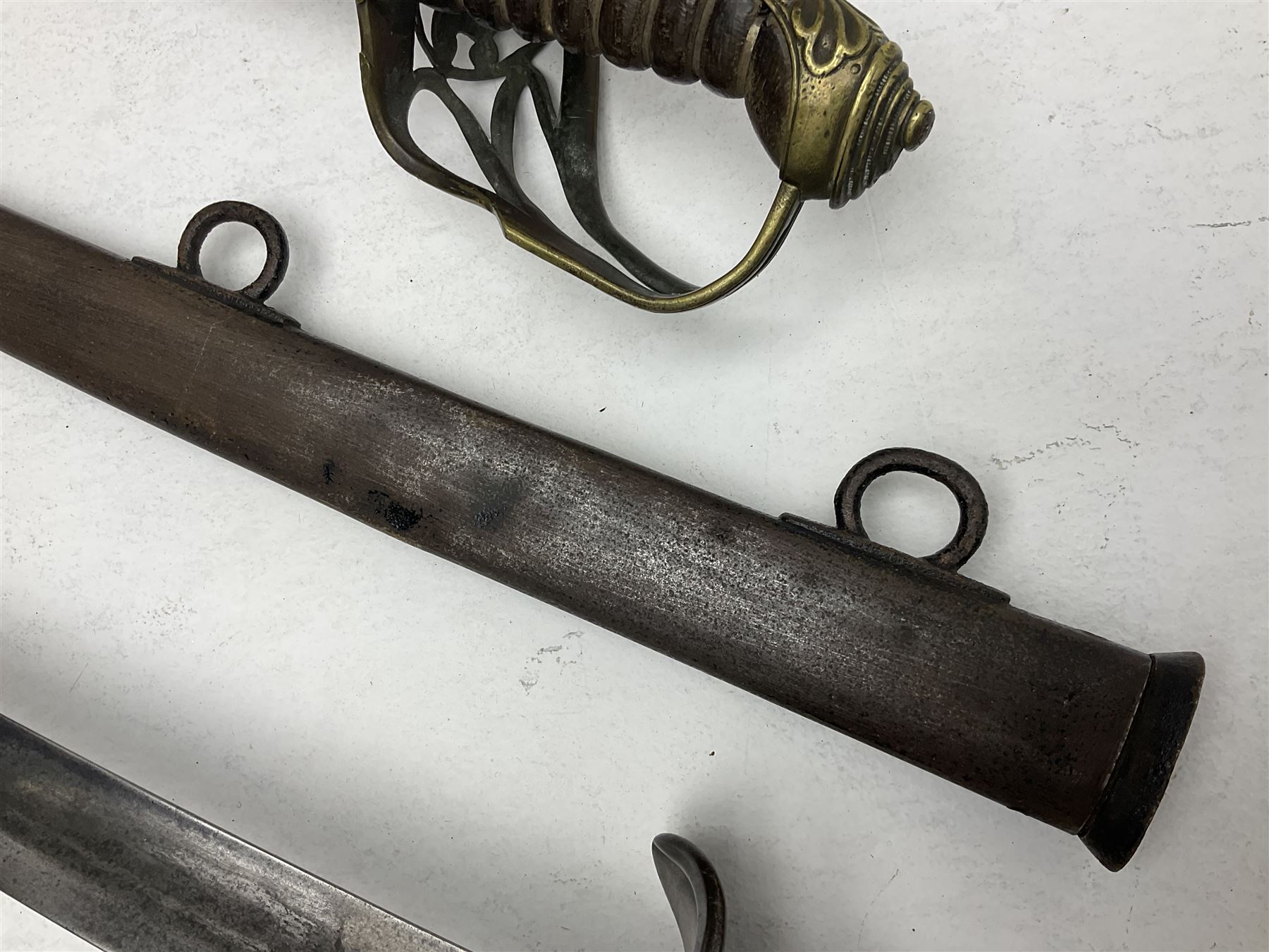 19th century Imperial German army heavy cavalry officers sword by Schnitzler and Kirschbaum, with 89cm single fullered steel blade and sheet steel basket hilt with teardrop cut-out and wire-bound leather grip L107.5cm overall; in steel scabbard with two suspension rings; and British Army 1822 Pattern Infantry Officer's sword in associated scabbard (2)