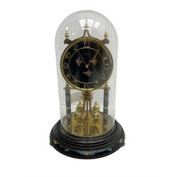 Kundo 1960’s torsion clock with a skeleton movement and four ball oscillating pendulum, with a glass dome. Torsion spring intact.
