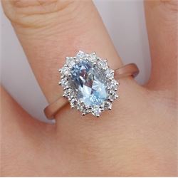18ct white gold oval aquamarine and round brilliant cut diamond cluster ring, hallmarked, aquamarine approx 1.20 carat