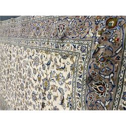 Kashan ivory ground rug, floral field, repeating brder