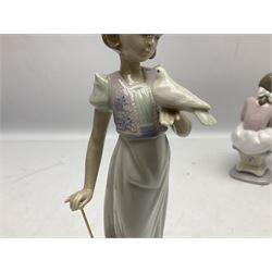 Three Lladro figures, comprising Garden Classic, signed no 7617, Summer Stroll no 7611 and Best Friend no 7620, all with original boxes, largest example H24cm 