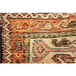  Oriental beige ground rug, central medallion, repeating border, 210cm x 102cm  