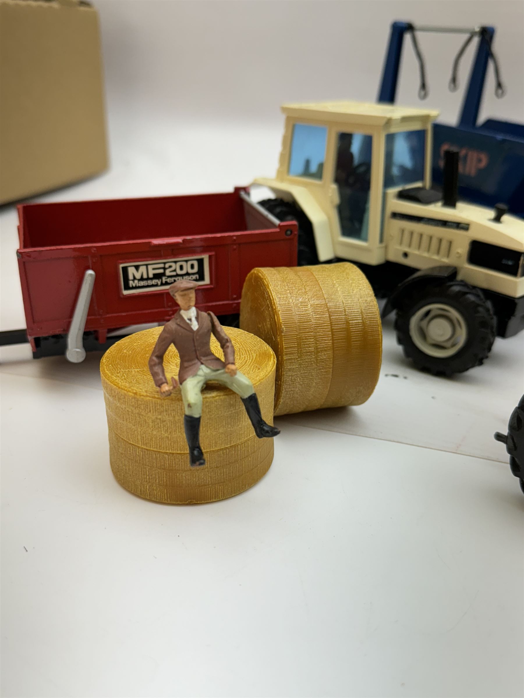 Collection of predominantly late 1970s/early 1980s Britains diecast vehicles and farming equipment, including Corn King, tractors, JCBs, horsebox, skip lorry, etc together with figures and accessories