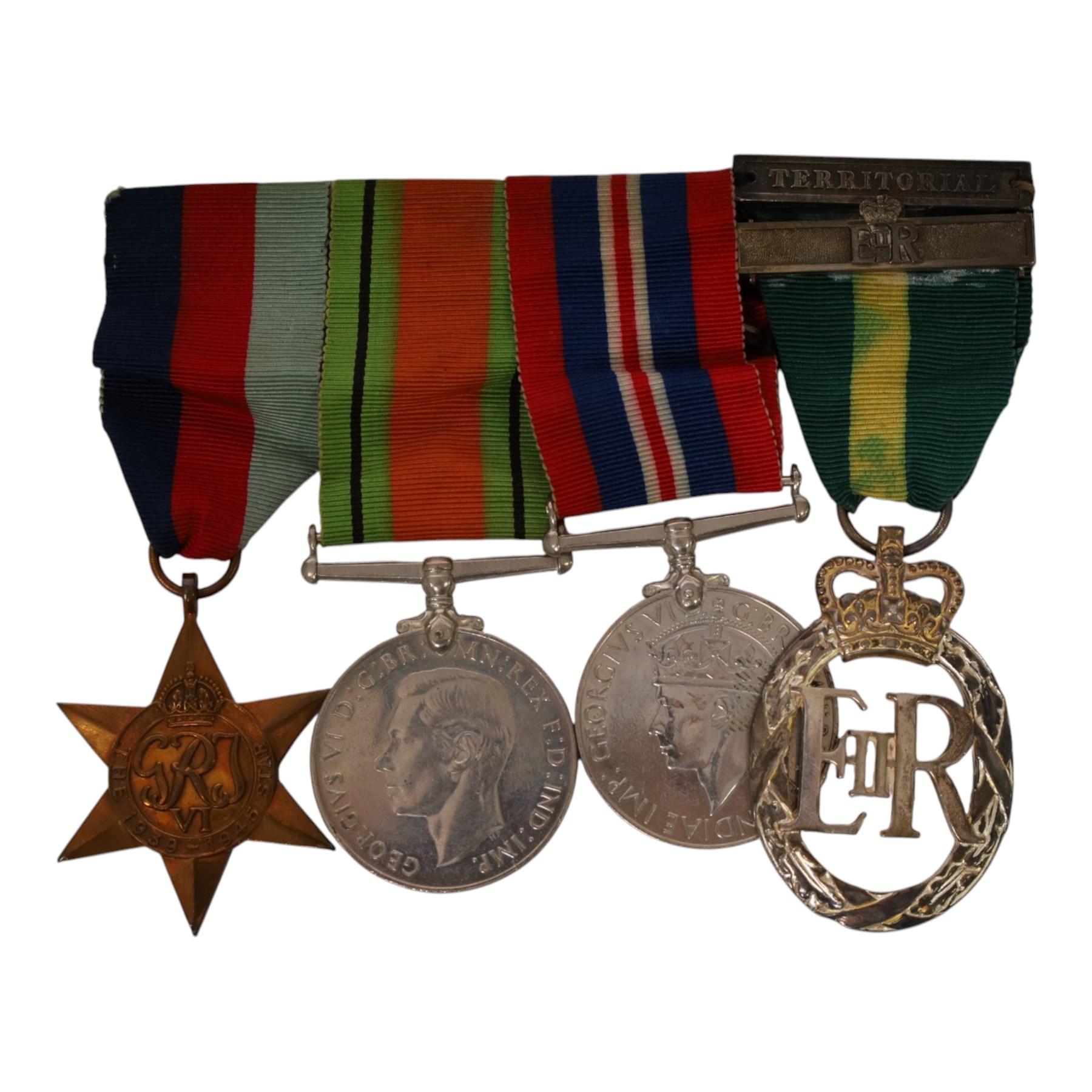 WWII British medal group comprising War medal, Defence medal and 1939-1945 star, together with EII Efficiency Decoration with Territorial bar, with 1955 engraved to reverse 