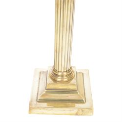 Victorian brass oil lamp, the Corinthian column supporting a cranberry glass burner and opaque etched cranberry glass shade and clear glass chimney, overall H77cm