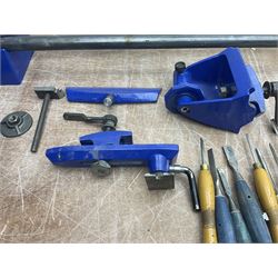 Record wood turning lathe and motor, with a three jaw chuck, tailstock and tool rest, selection of wood turning and woodworking chisels, electric bench grinder with grinding wheel and collet chuck plus a Record bench vice.