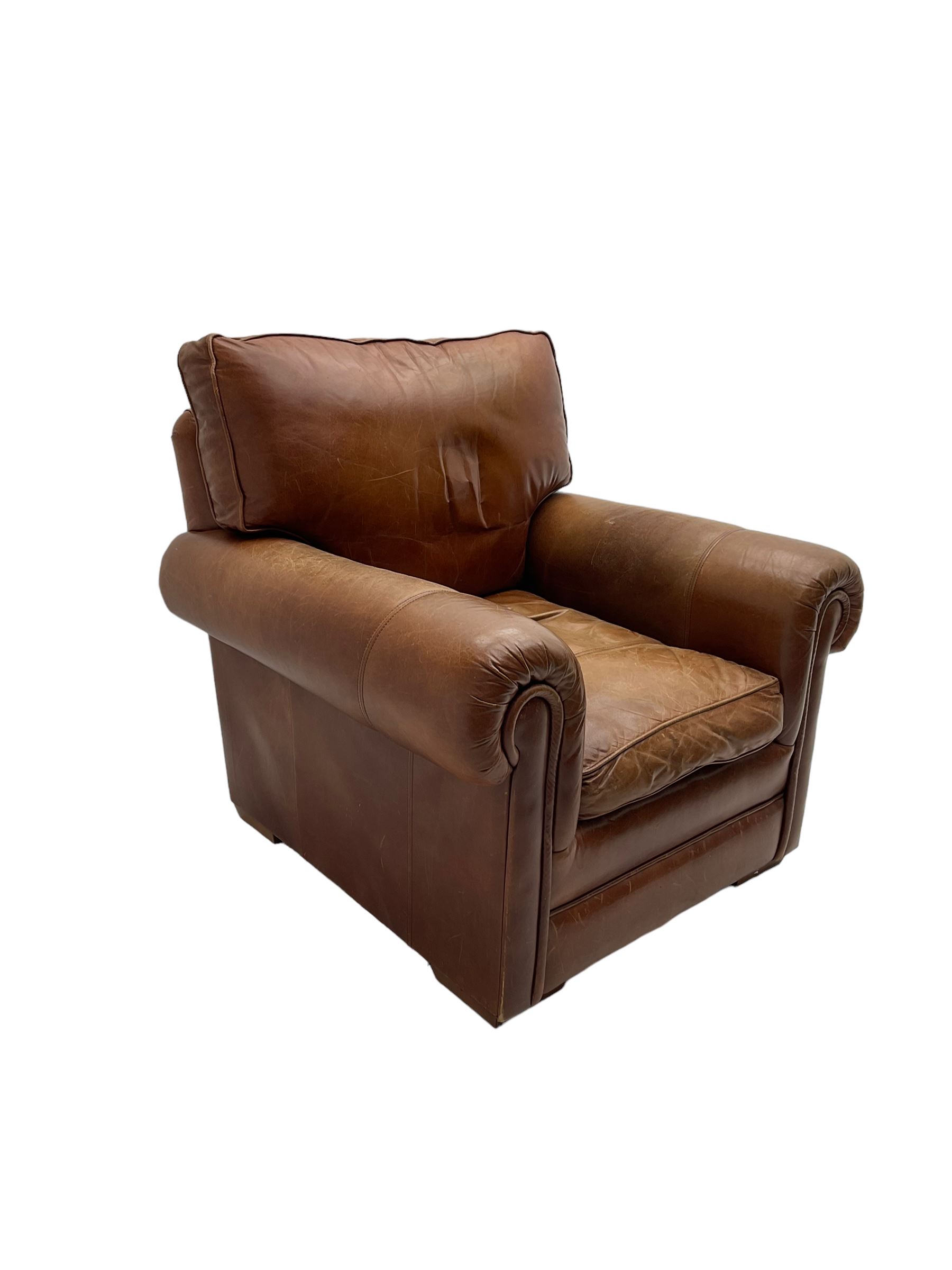 Large two seat sofa upholstered in tan 'Derwent' leather (W200cm D100cm H85cm), and matching armchair (W95cm)