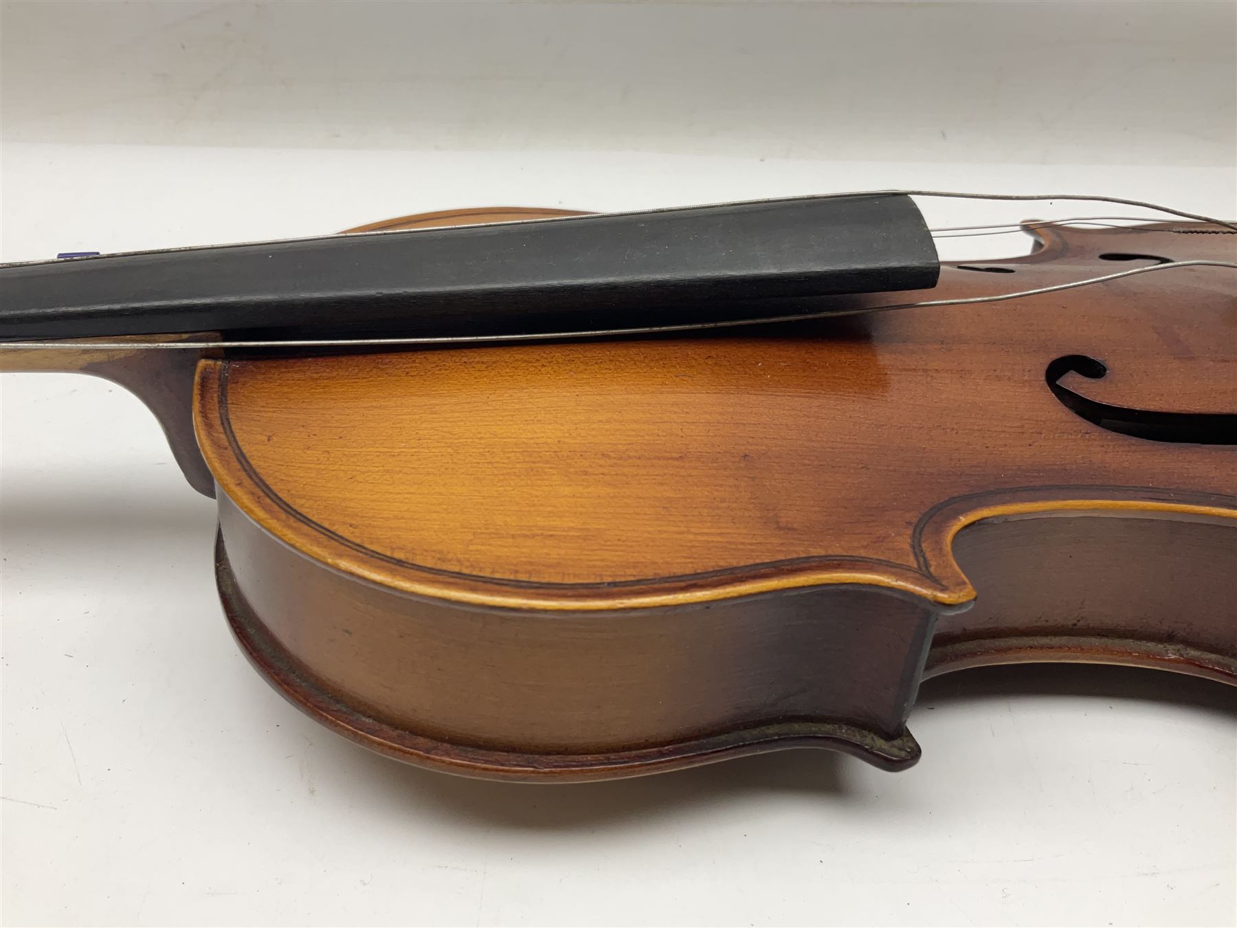 Saxony (?) violin c1950 with 36cm two-piece maple back and ribs and spruce top; bears label 'The Maidstone School Orchestra Association' L59cm overall; and 1950s Czechoslovakian violin for restoration; both in carrying cases (2)
