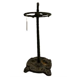 Cast iron stick and umbrella stand, the base cast with c-shape scrolls