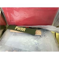 Quantity of military horse hair plumes and feather hackles, cloth stripes and regimental titles etc