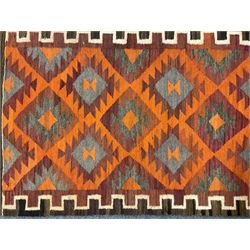 Turkish Kilim amber ground rug, field decorated with all over lozenges, geometric border and striped ends