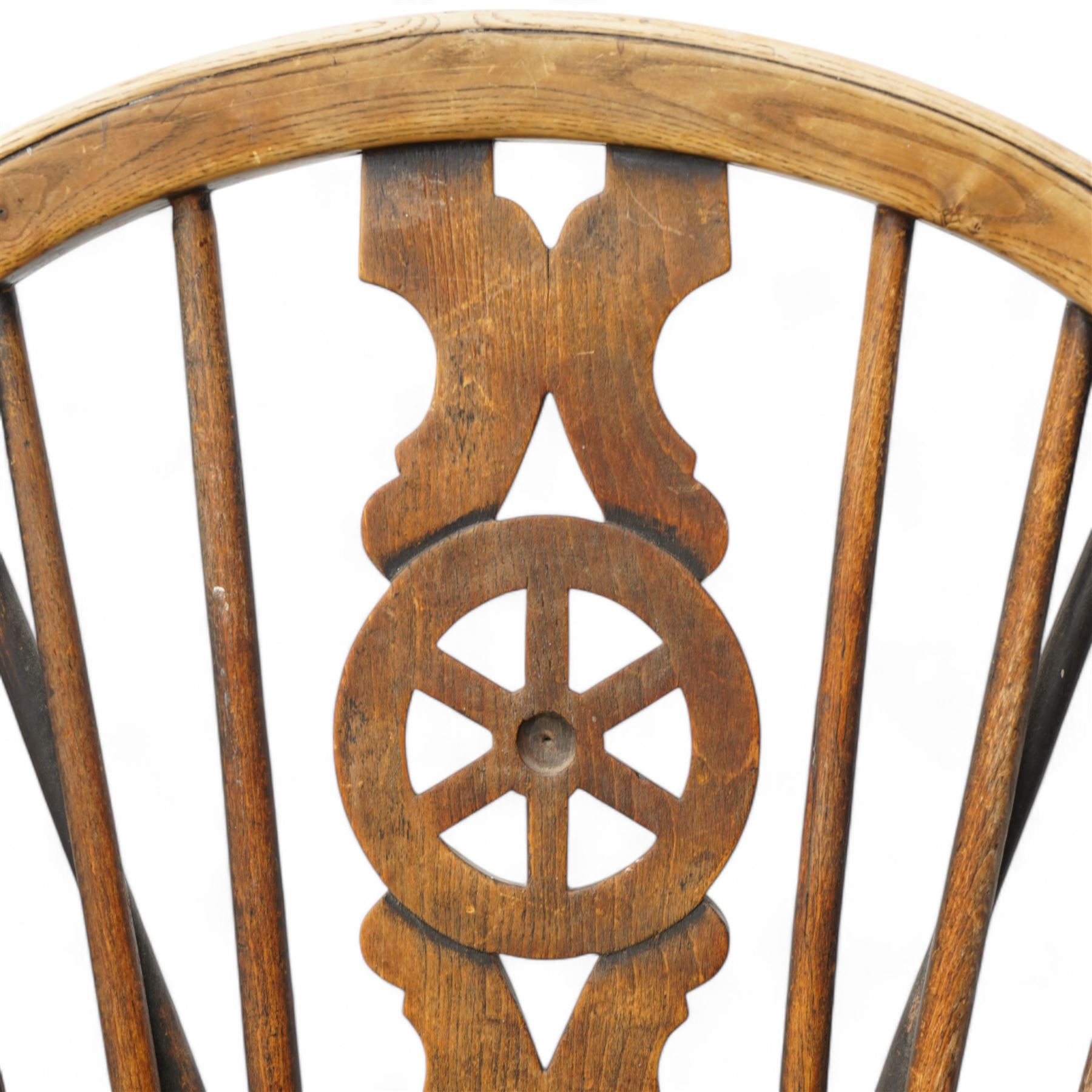 19th century elm and beech hoop and stick back Windsor chair, dished seat on turned supports united by H-stretchers, the seat stamped 'T.H. Filmer C&M 1859' (W38cm, H86cm);19th century elm and beech Windsor chair, hoop and stick back with pierced wheel splat, dished seat on turned supports united by swell turned stretchers (W36cm, H88cm)