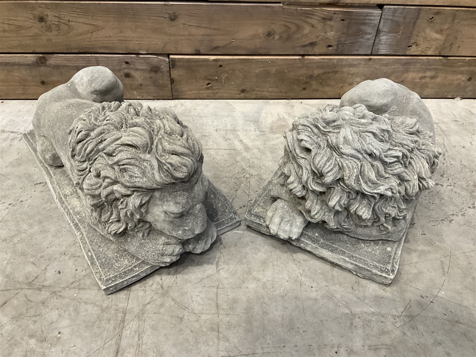 Pair of small recumbent garden lions