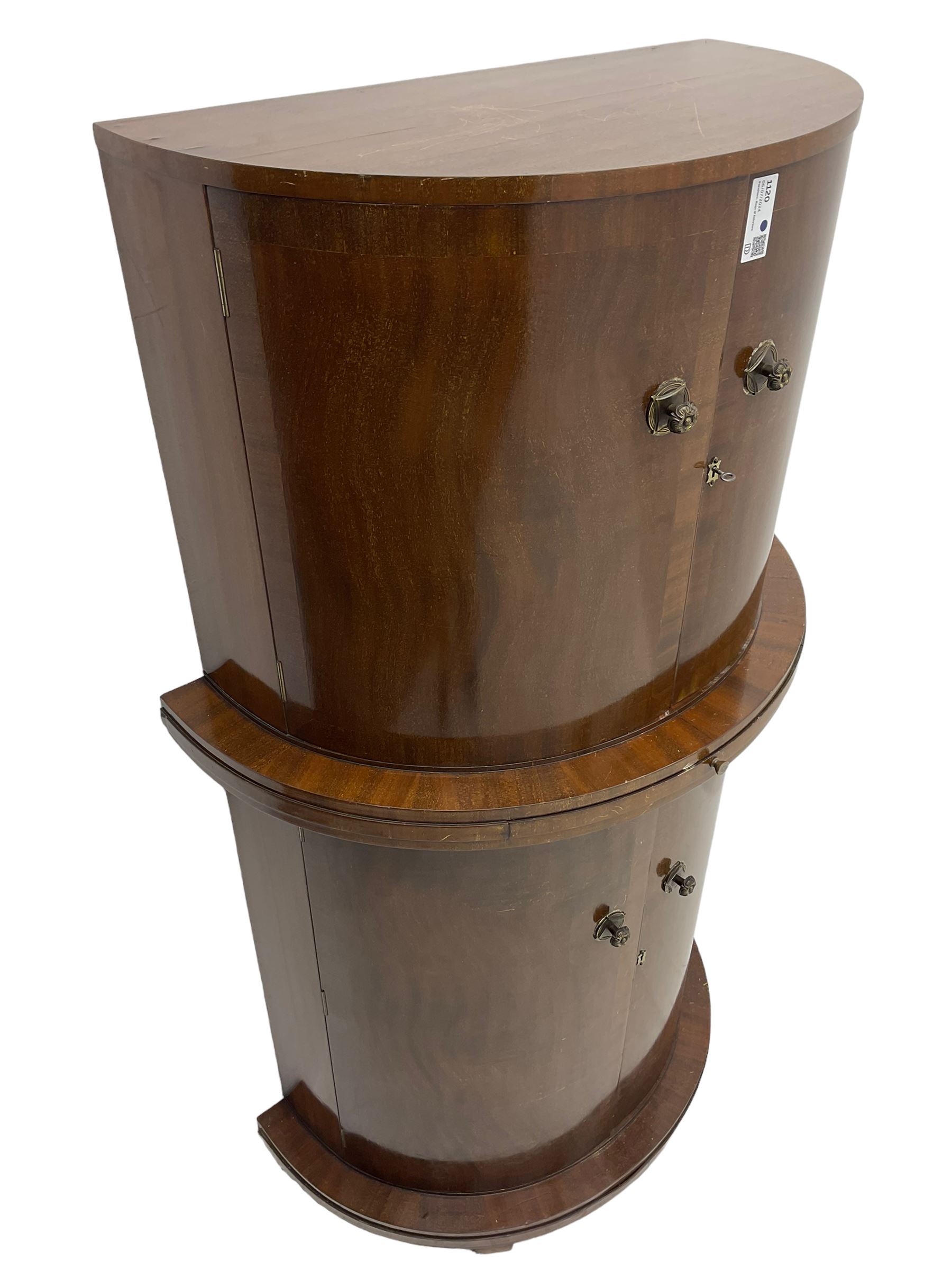 1930s Art Deco walnut demi-lune cocktail cabinet, enclosed by four curved doors, the upper section with mirrored interior, glass shelf and glass holders, the lower section fitted with shelves and bottle holders