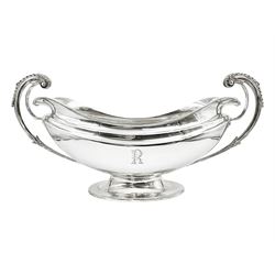 1920s silver twin-handled pedestal bowl, of navette form with twin bifurcated acanthus capped scroll handles, engraved with initial R to body and upon spreading oval foot, hallmarked Hawksworth, Eyre & Co Ltd, Sheffield 1925, including handles H21.8cm