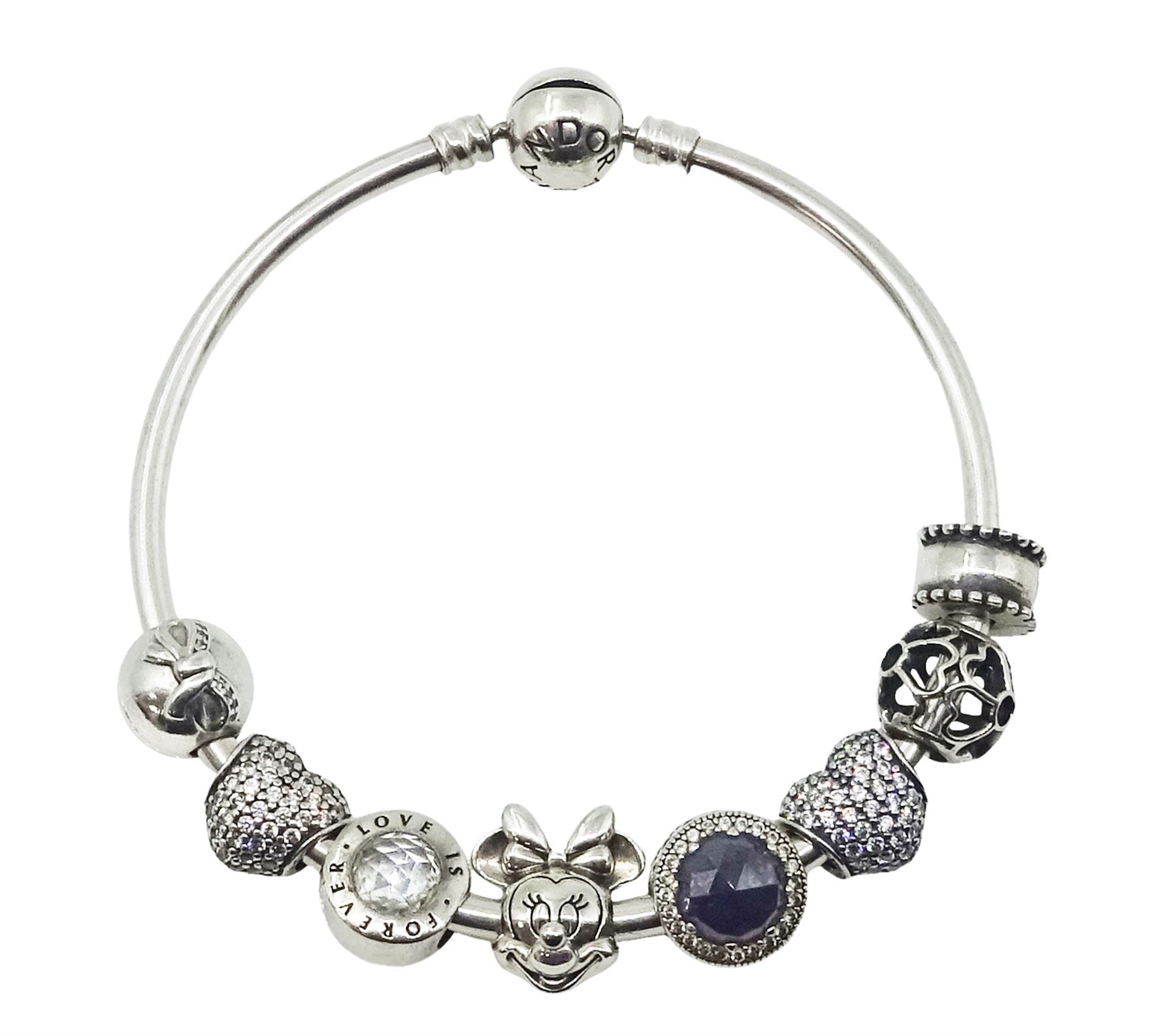 Pandora silver charm bracelet with a Disney Minnie Mouse charm and seven other Pandora charms, all stamped S925 ALE