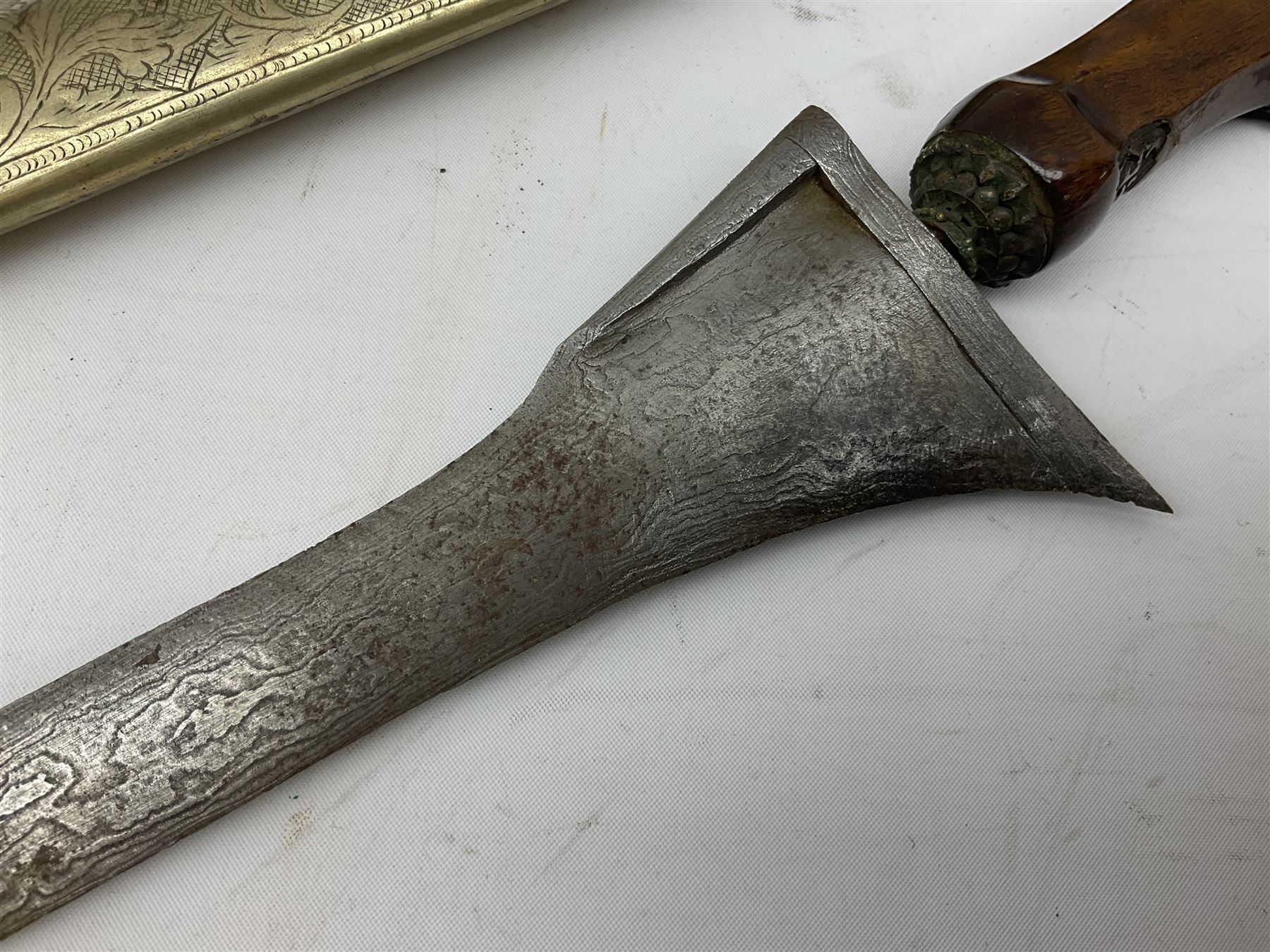 Malayan Kris dagger, the 31.5cm double edged straight heavy damascus blade with copper ferrule; carved hardwood grip; in large wooden throated scabbard with floral decorated white metal covering L47.5cm overall; a kris blade with adapted antler grip; and five various small daggers/letter openers (7)