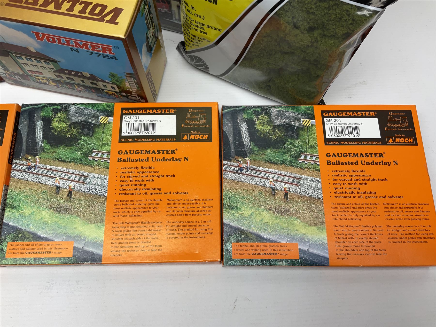 'N' gauge trackside accessories - seven Faller buildings and bridges etc Nos.N212113, N222121, N222583, N222174, N222128, Z282730 & Z282707; two others by Vollmer Nos.N7657 & N7724; four boxes of Gaugemaster Ballasted Underlay; grit and Foliage Clusters