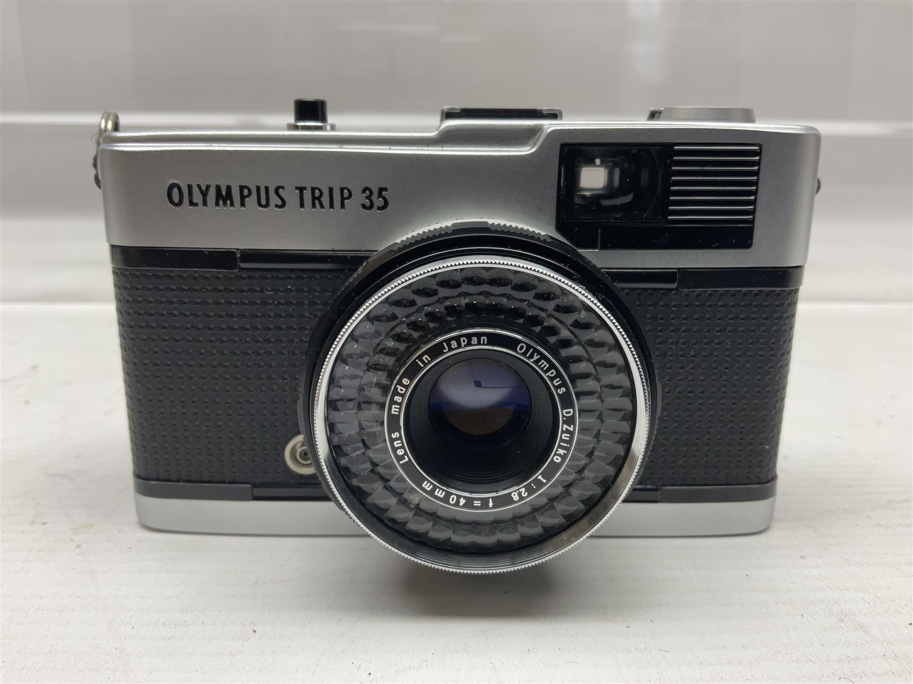 Four Olympus camera bodies, including Olympus OM10, serial no 20744269, with 'Olympus OM-System Zuiko Auto-S 50mm 1:1.8' lens serial no 3633644, Olympus OM-2 camera body serial no 460280 with 'Olympus OM-System G.Zuiko Auto-s 1:1.4 f=50mm' lens, serial no 729750, etc 