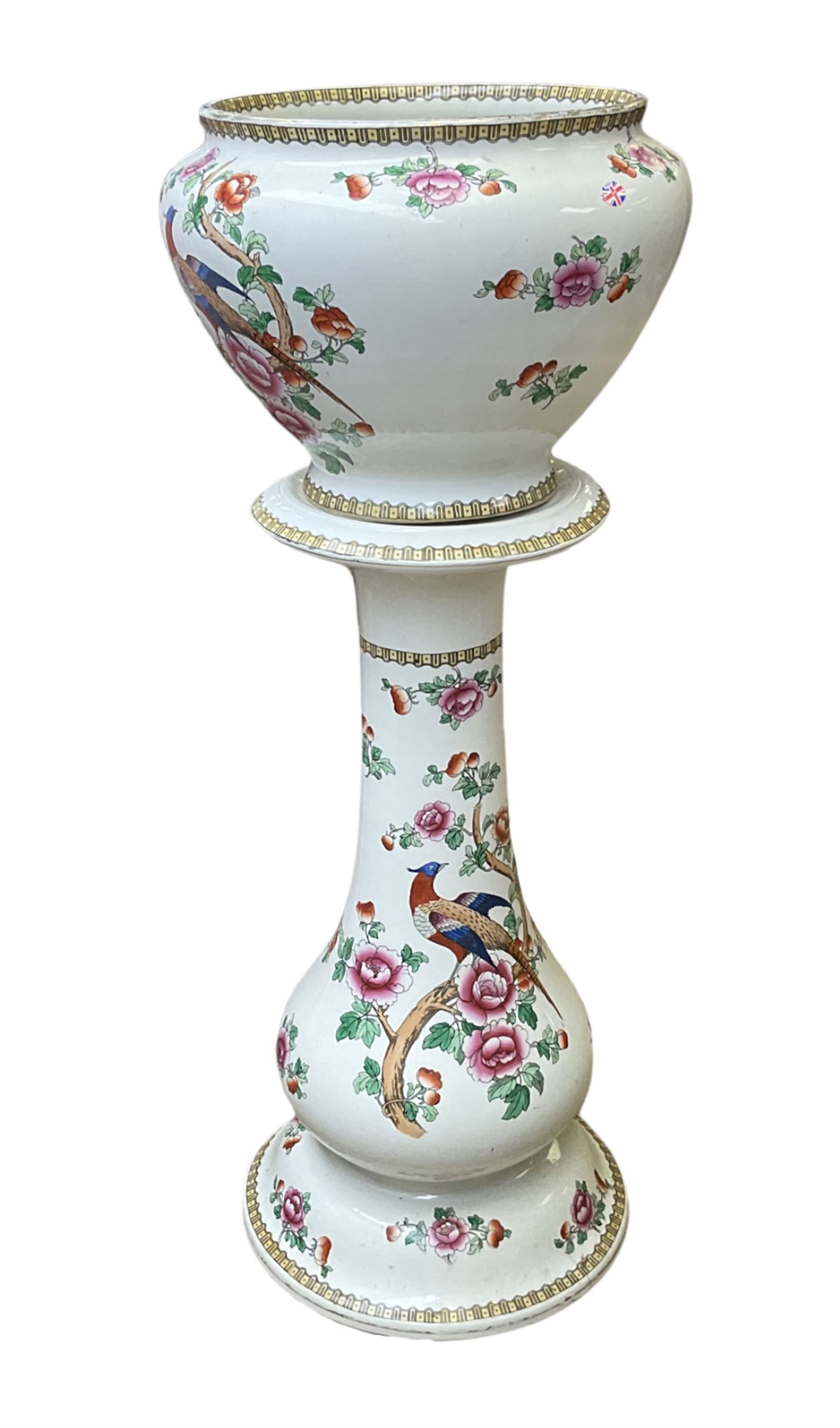 Large ceramic Jardiniere on stand, decorated with an oriental pheasant perched upon branches blossoming with peonies and foliage on white ground, overall H99cm