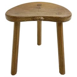 Mouseman - oak three legged milking stool, dished kidney-shaped top on three splayed supports, carved with mouse signature, by the workshop of Robert Thompson, Kilburn