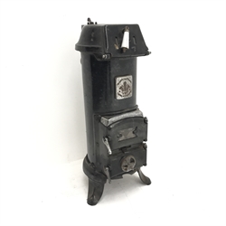 Early 20th century French black enamel cast iron stove, three hinged doors to the front, W35cm, H79cm, D40cm