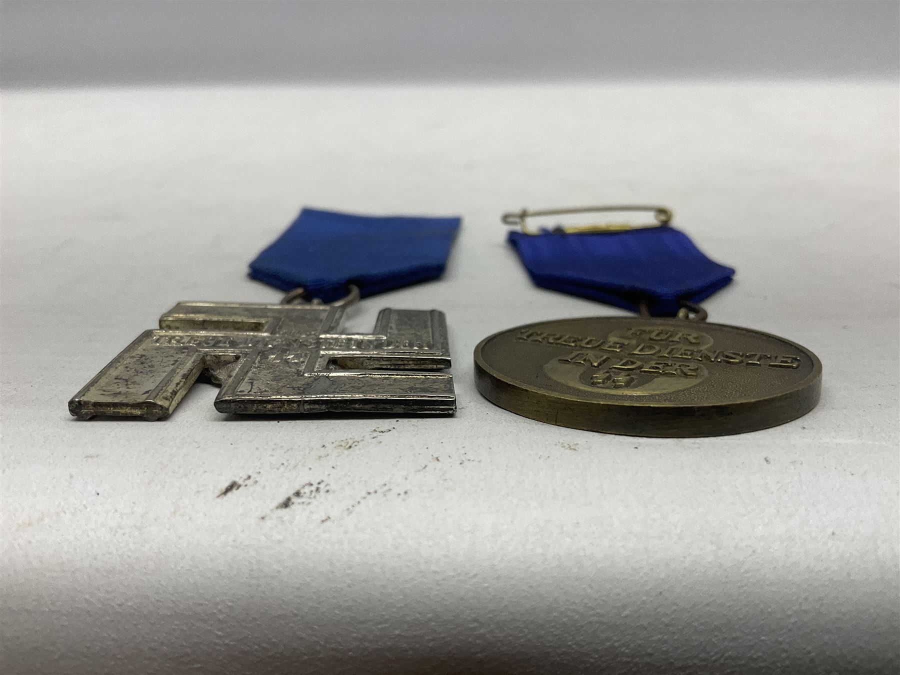 Two post-WW2 copies of German 'SS' Long Service Awards - bronze 8-year medal and silvered 12-year medal; both with ribbons (2)