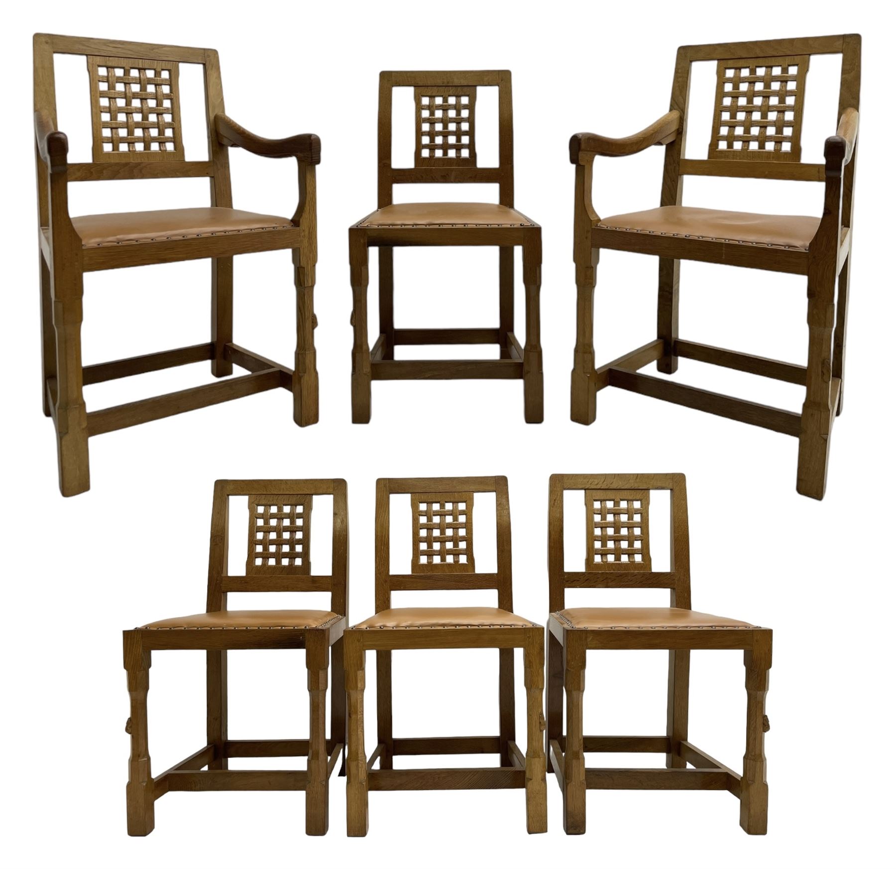 Rabbitman - set of six (4+2) oak dining chairs, carved and pierced lattice back, tan leather upholstered seat with stud band, on octagonal supports united by H-stretchers, carved with rabbit signature, by Peter Heap, Wetwang 