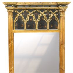 Tall Gothic Revival ebonised and gilt pier mirror, the projecting cornice with foliate ornament and applied spherical mounts, over a Gothic tracery frieze with trefoil motifs, the bevelled rectangular plate flanked by fluted Neoclassical columns with acanthus capitals, on a stepped ebonised and gilt plinth base with globular mounts