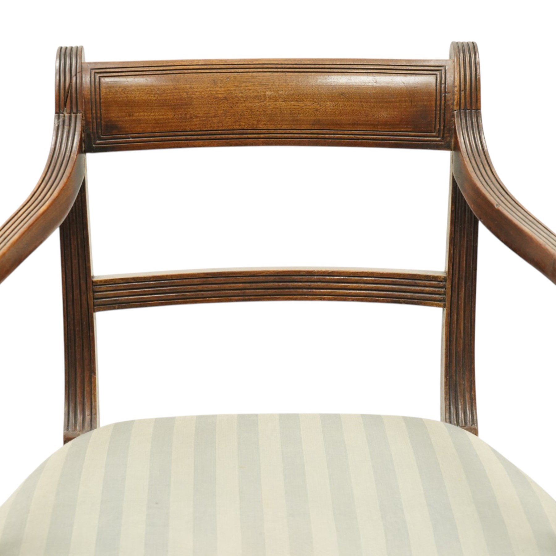 Georgian mahogany reeded carver armchair or elbow chair, bar back and scrolled arm terminals above over-stuffed seat, raised on sabre supports