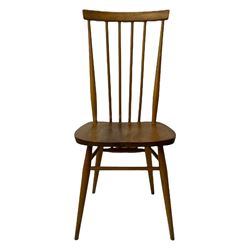 Ercol - pair of mid-20th century highback 'Windsor' chairs, curved top rail over six vertical spindles and shaped seat, on tapering cylindrical supports with stretchers