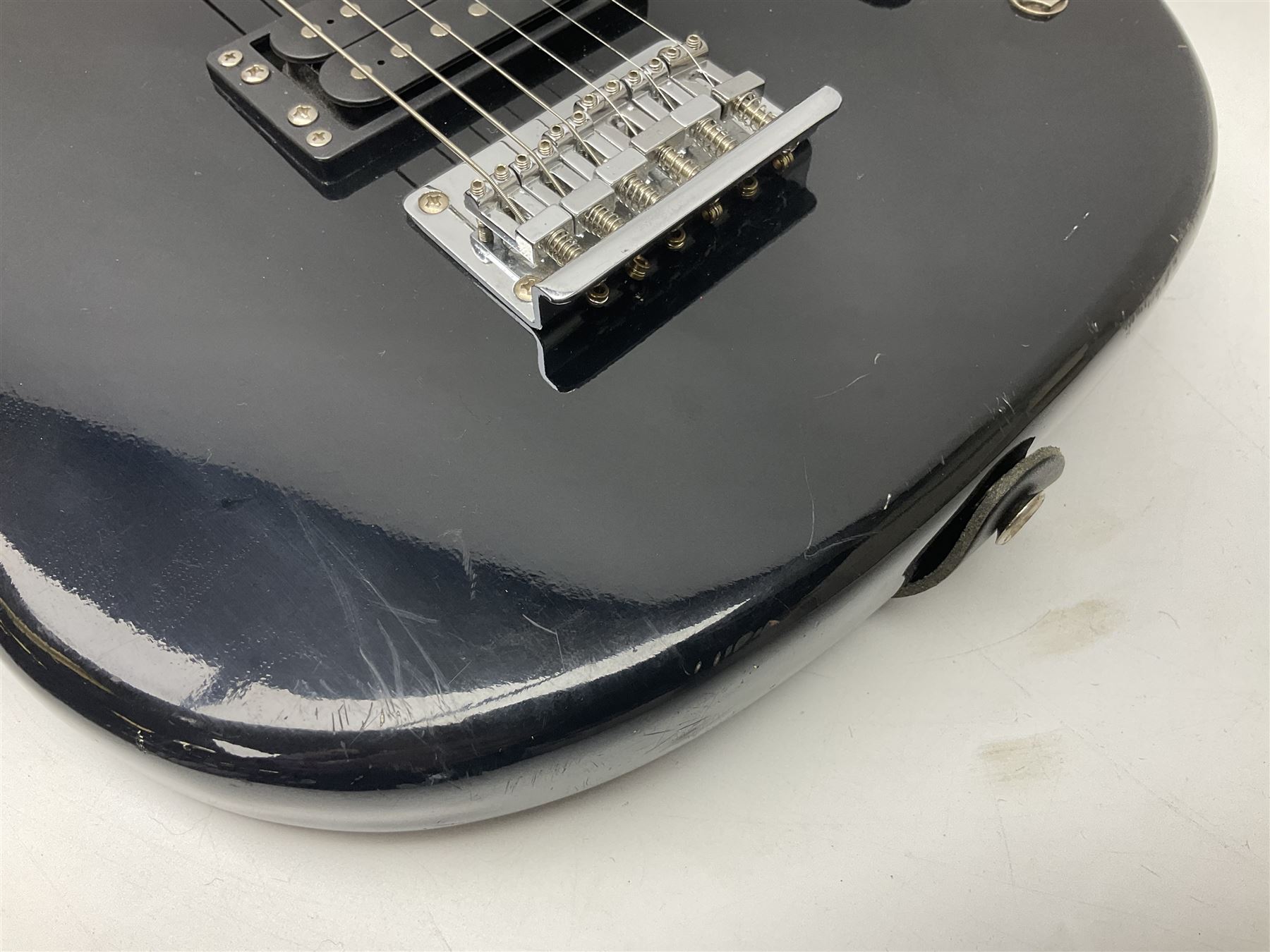 Encore black electric cut-away guitar L96cm; and Spanish Victor Garcia model 187 acoustic guitar, bears label dated 1972 L99cm; each in soft carrying case (2)