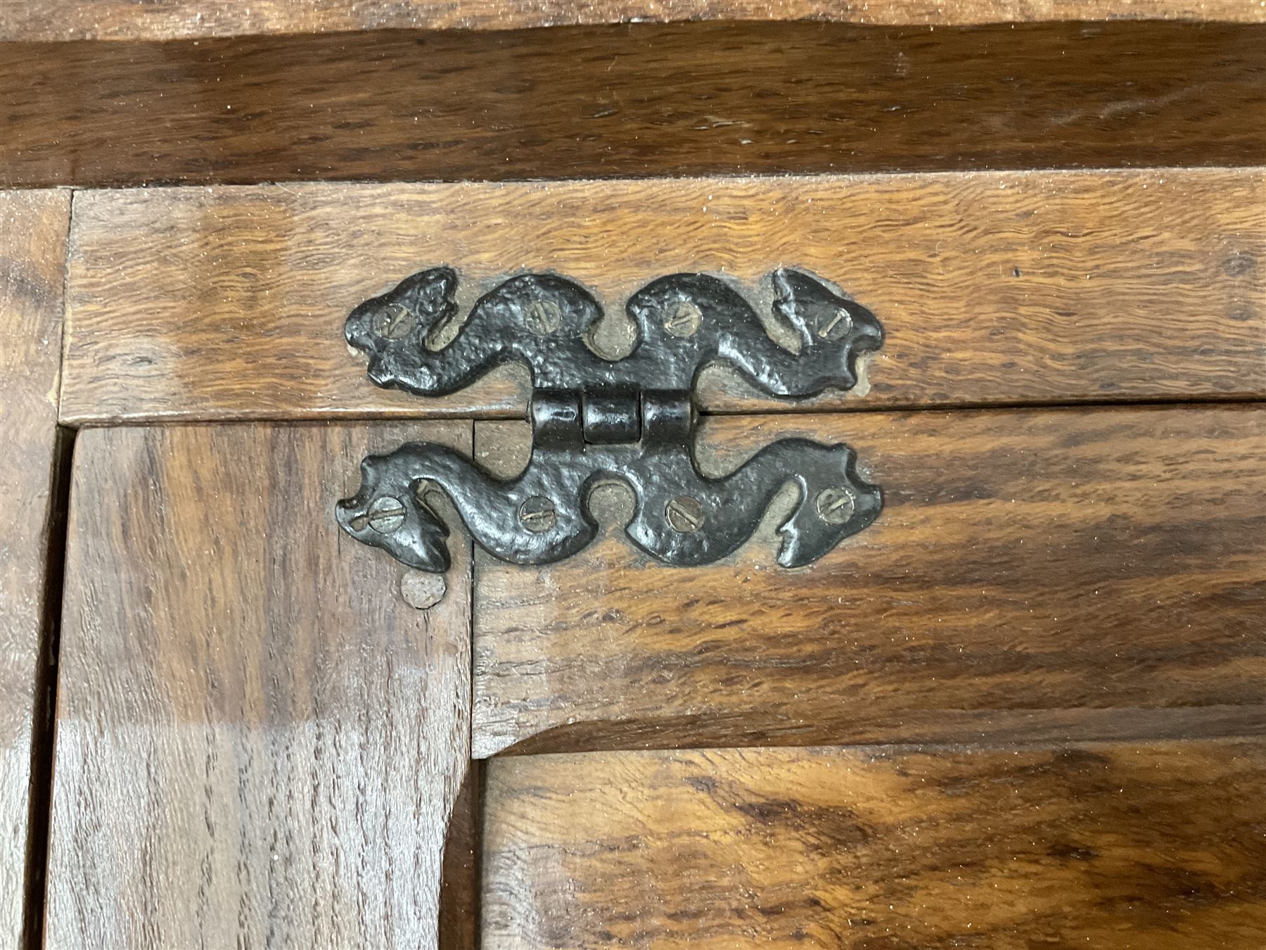 'Acornman' figured oak telephone table, panelled back above hinged seat and two drawers, panelled sides and front, all over adzing, by Alan Grainger of Brandsby, York
