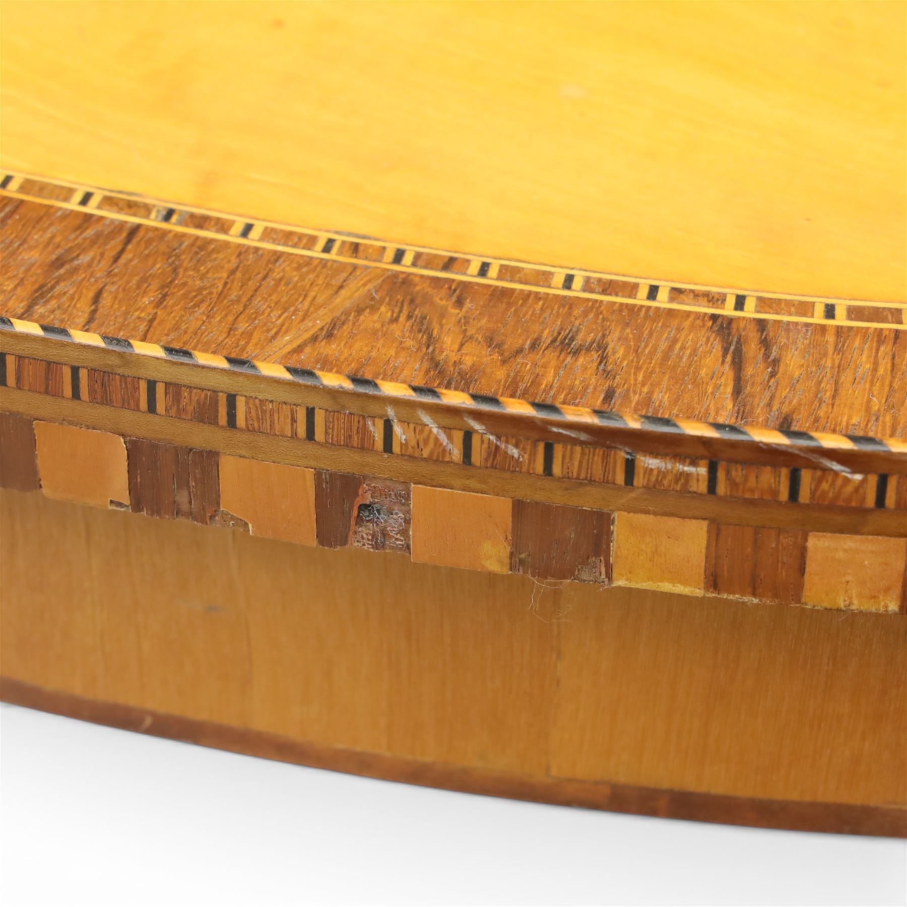 Early 19th century Sheraton revival satinwood oval table, shell motif to the centre bordered by walnut veneer, with inlaid banding, supported on square tapering legs terminating in brass feet