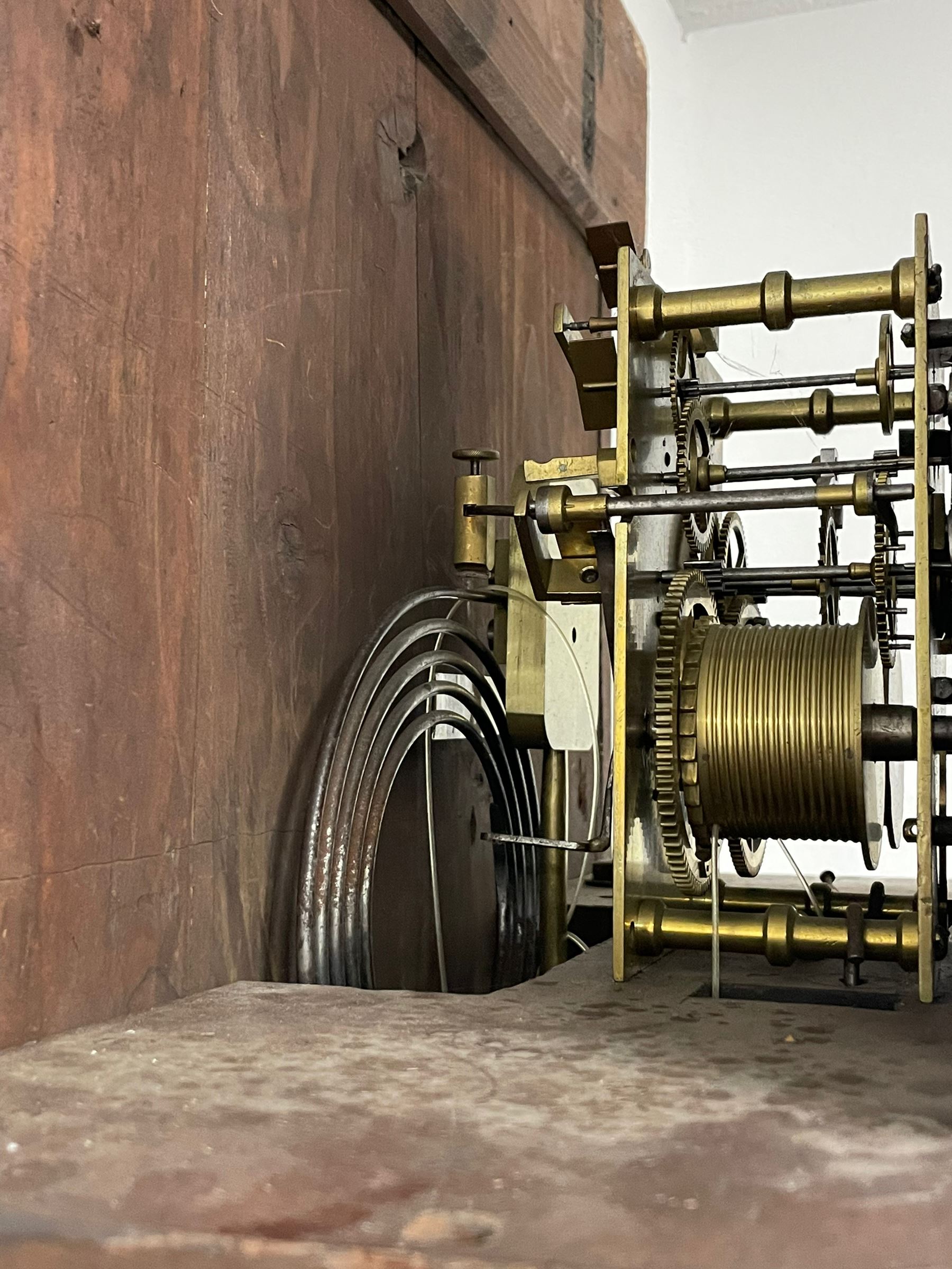 John Stonehouse of Leeds - mahogany 8-day longcase clock with a painted oval dial c1830, hood with a swans necked pediment and profuse contrasting inlay to both the hood and case, oval hood door with flanking pilasters and Corinthian capitals, conforming case with canted corners and short triple spire door, broad plinth with matching inlay and canted corners on shallow base, dial depicting masonic regalia, symbols, and pictorial depictions of the humanities, faith, hope, charity and righteousness, black chapter with white roman Arabic’s, date recorder and matching “crown” hands, dial pinned to a rack striking movement with a recoil anchor escapement, striking the hours on a coiled underslung gong. With weights and gridiron pendulum. 
This clock case is of large, impressive dimensions and was almost certainly commissioned for a large masonic lodge in Leeds, a rare and unique example.