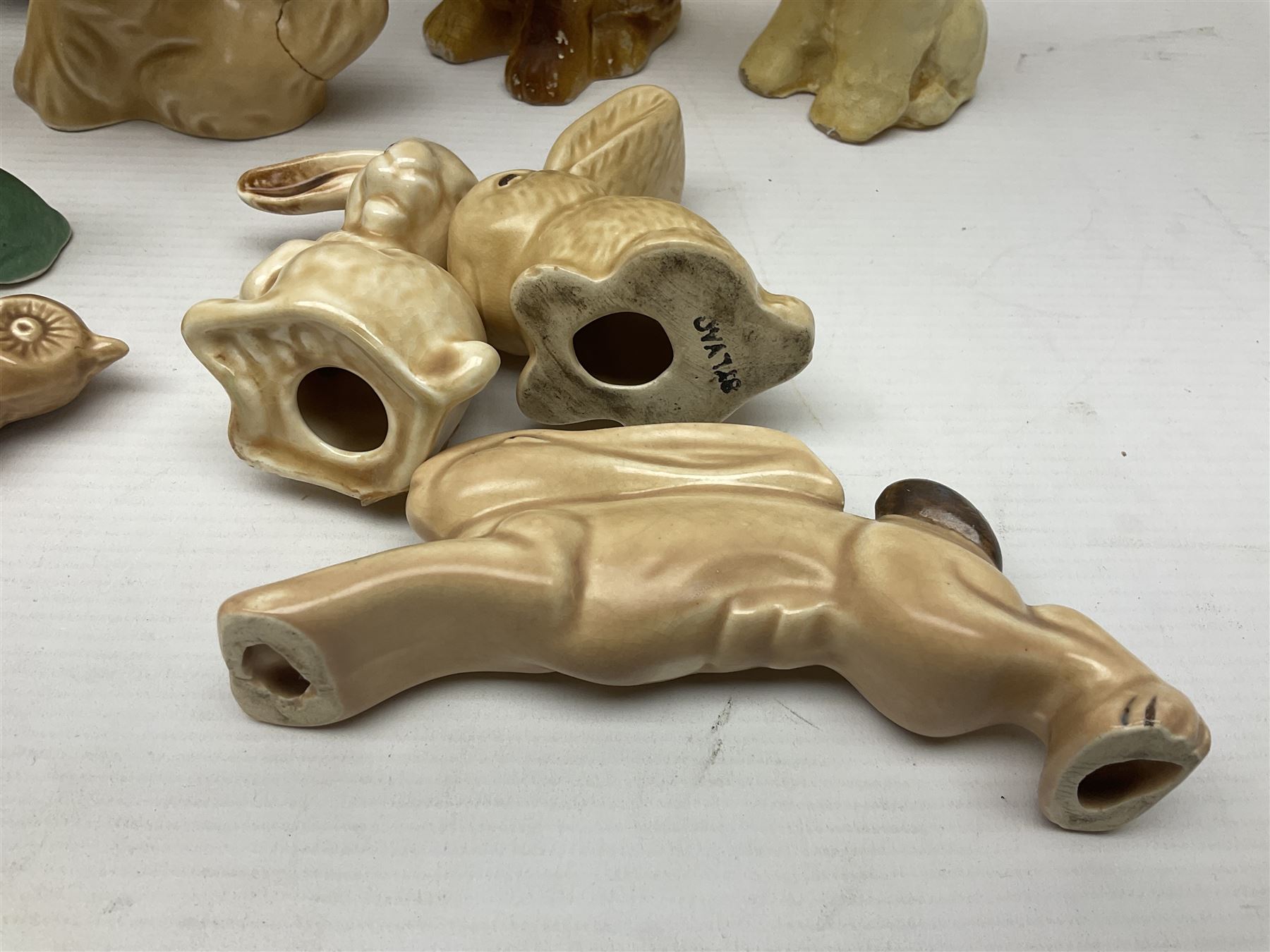 Collection of Sylvac and similar animal figures, including rabbits, hares and dogs, together with Falcon budgie vase, etc 