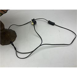 Tiffany style lamp in the form of a semi nude woman holding up a leaded lampshade together with a similar table lamp