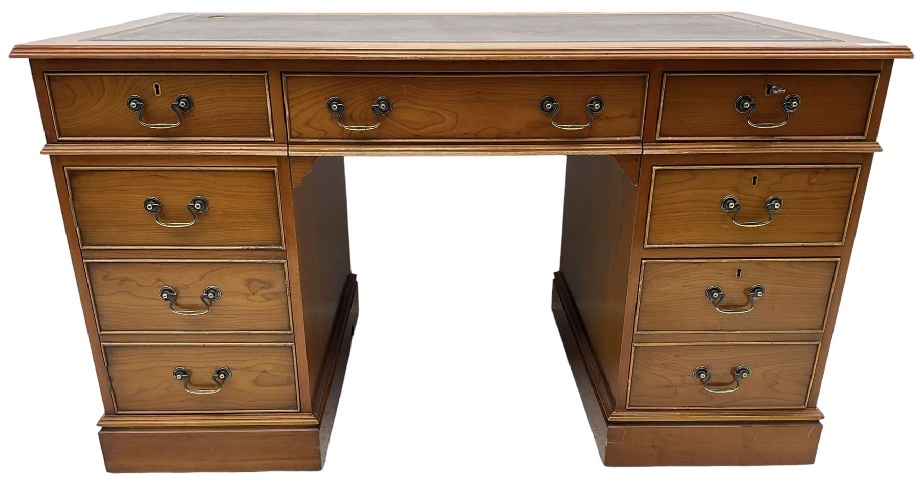 Cherrywood twin pedestal desk, rectangular leather inset top over central fall front with keyboard slide and two drawers, fitted with two drawers and cupboard, on bracket feet