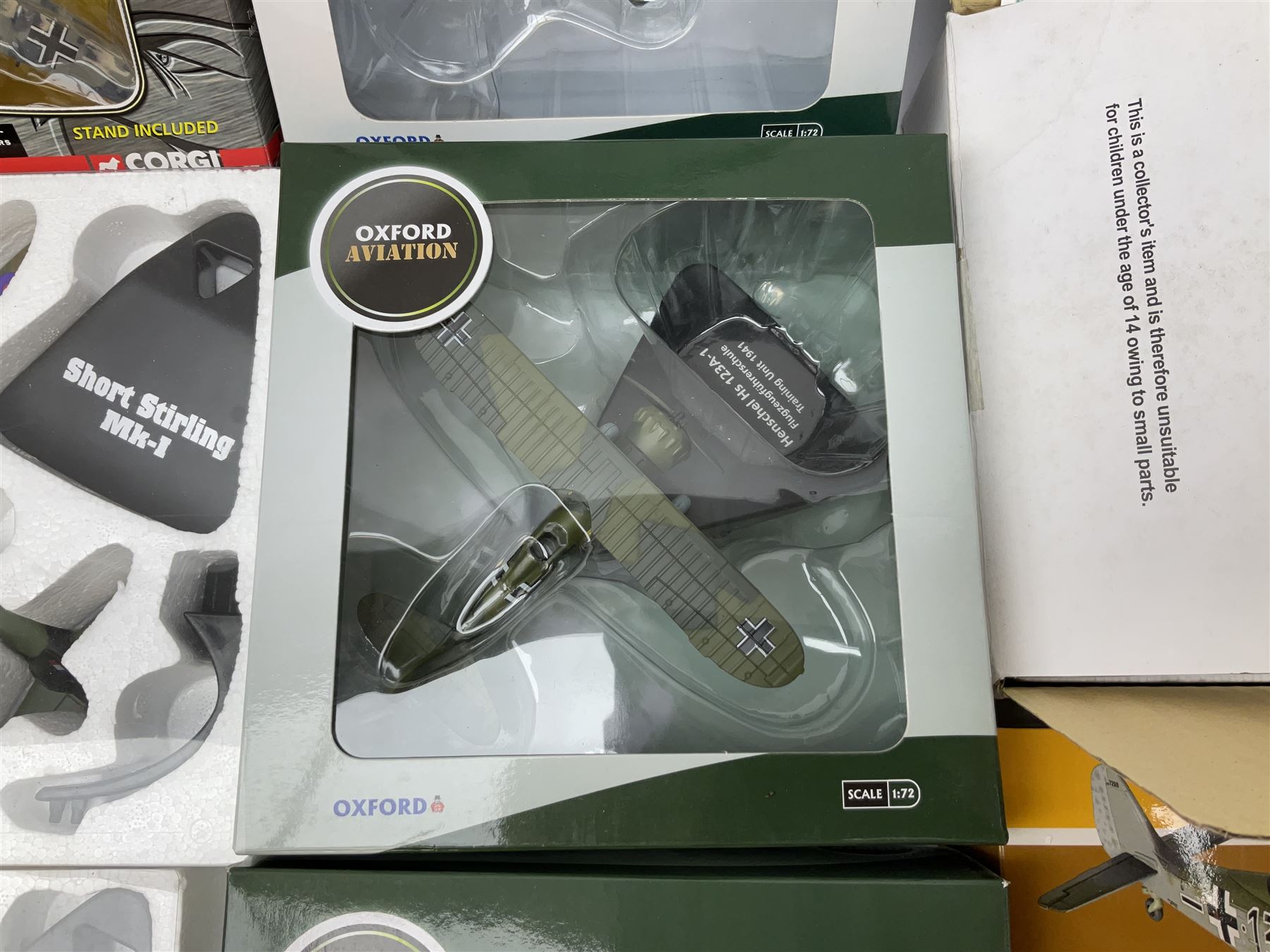 Fourteen die-cast models of aircraft including four Oxford Aviation, two Military Giants of the Sky, two Ixo Models, Corgi Warbirds Messerschmitt, Atlas Editions Spitfire and Messerschmitt, two Hobby Master etc; and two die-cast models of tanks; all boxed (16)