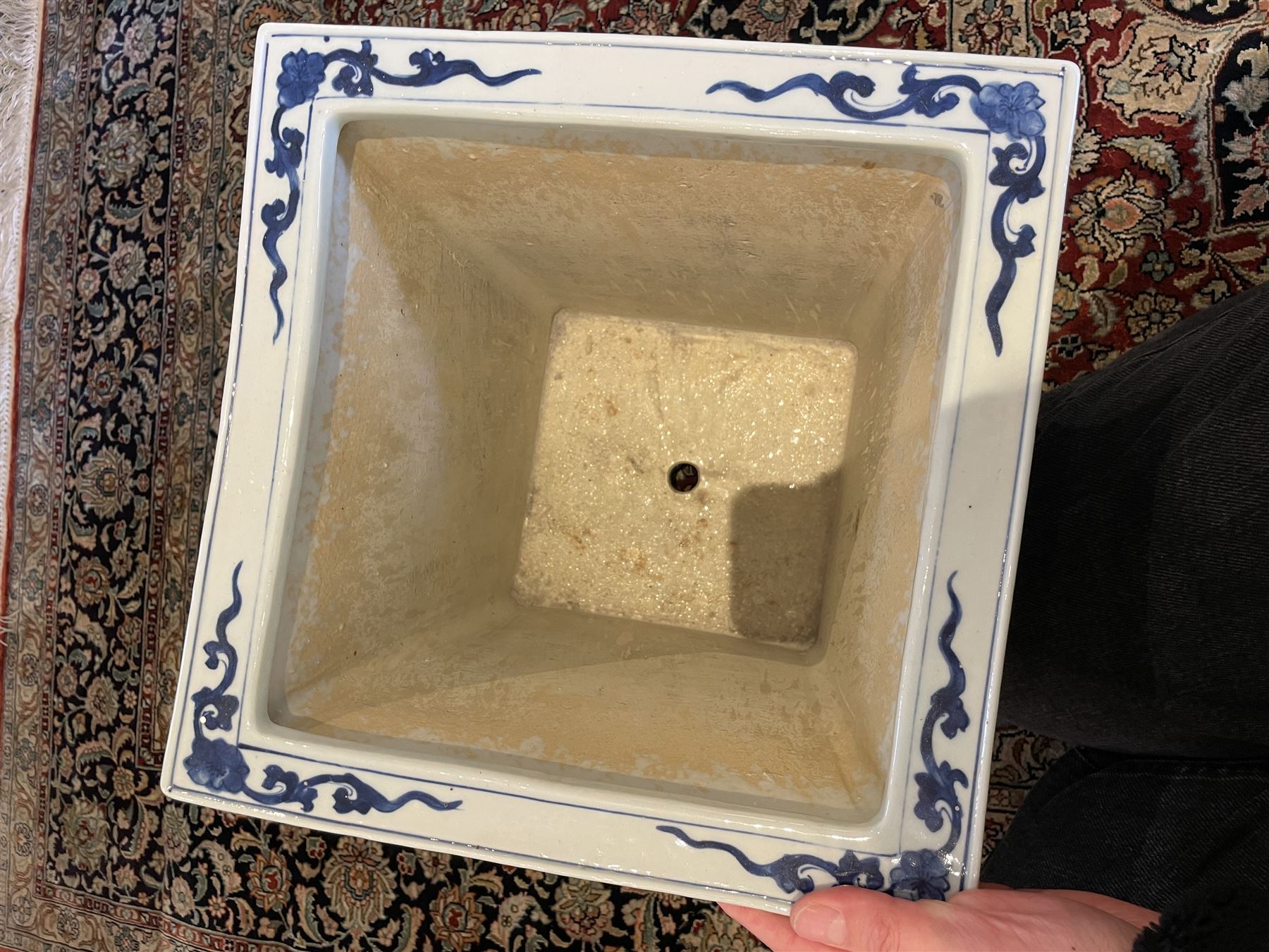 Chinese blue and white planter and stand, each of square slightly tapering and flared form, the planter decorated with two dragons and blossoming peonies, between stylised borders, the stand decorated with flower heads and vines, planter H30cm W29cm, stand H7cm D28.5cm